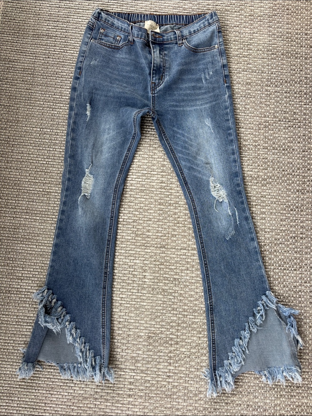 Hayden Medium Blue Distressed Flared Jeans with Frayed Triangular Hem